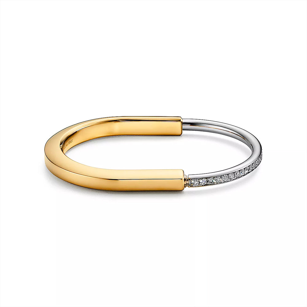 Tiffany & Co. Tiffany Lock Bangle in Yellow and White Gold with Half Pavé Diamonds