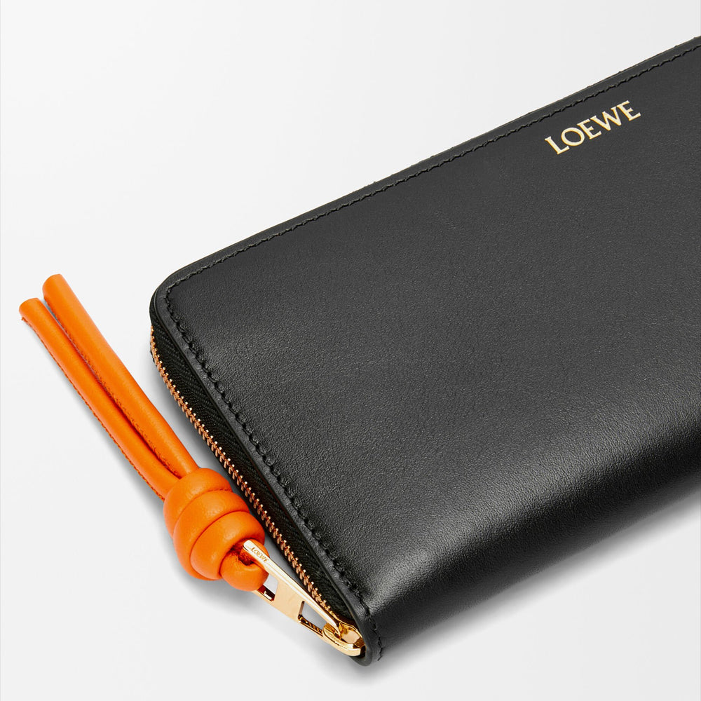 Loewe Knot zip around wallet in shiny nappa calfskin (Black/Bright Orange)